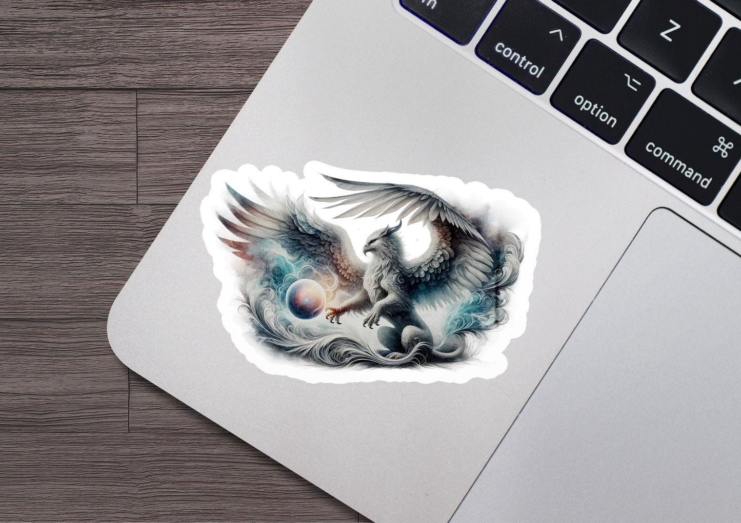 a laptop with a sticker of two birds on it