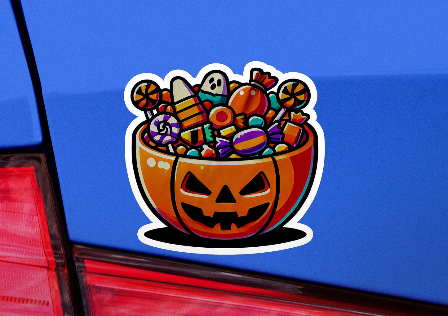 a sticker of a pumpkin with candy in it