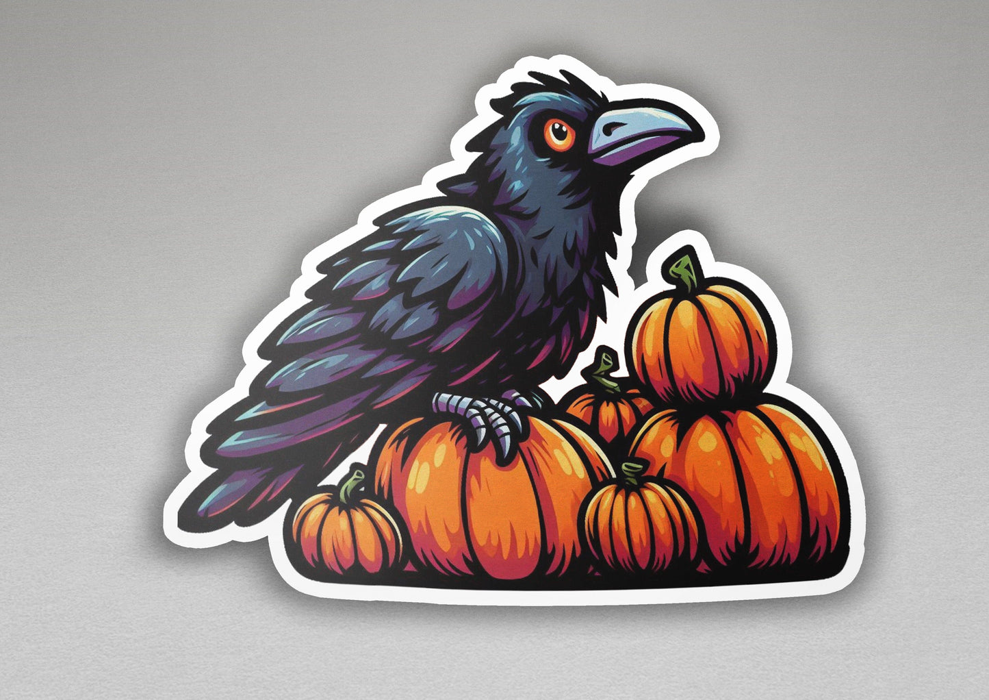 a black bird sitting on top of a pile of pumpkins