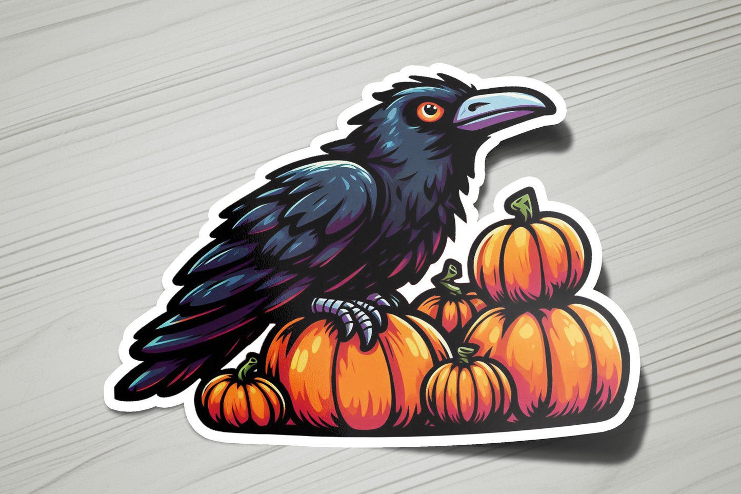 a black bird sitting on top of a pile of pumpkins