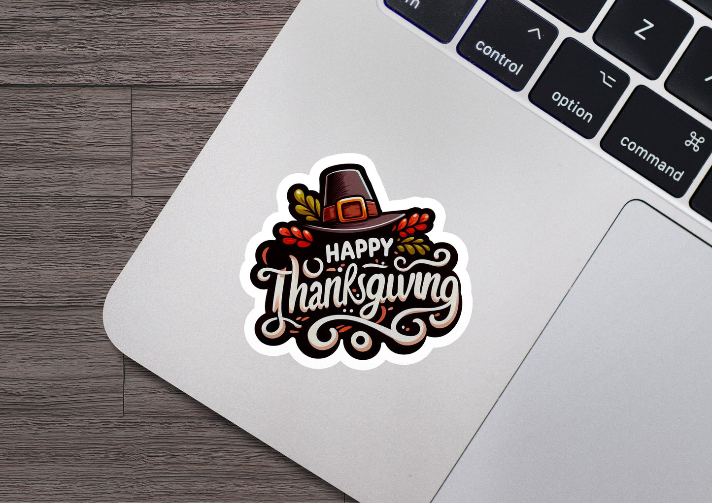 a sticker that says happy thanksgiving on a laptop