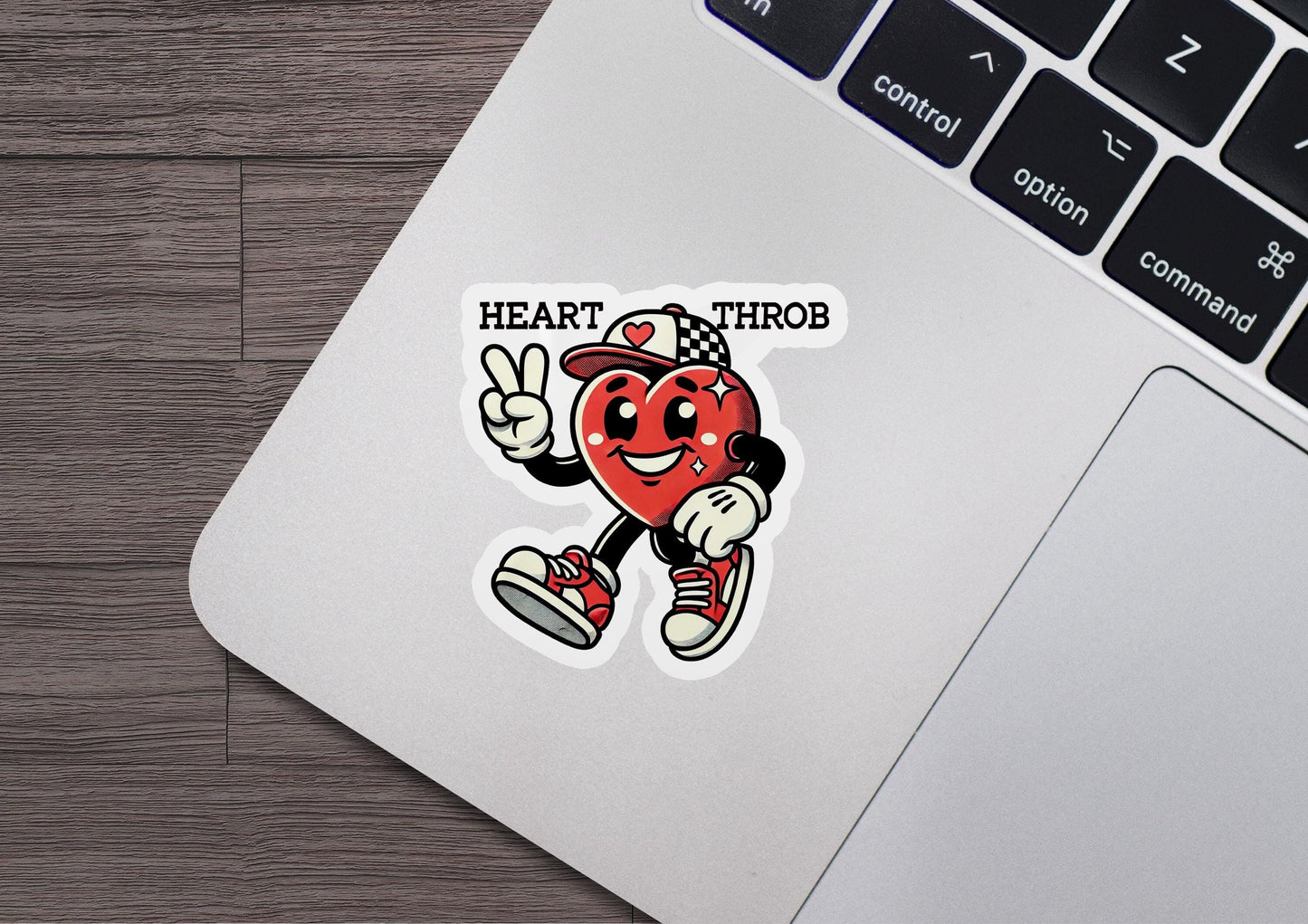 a laptop with a sticker of a heart hero on it