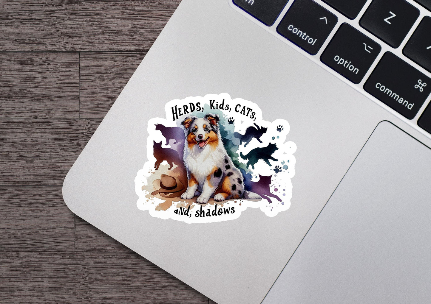 a sticker of a dog sitting on top of a laptop