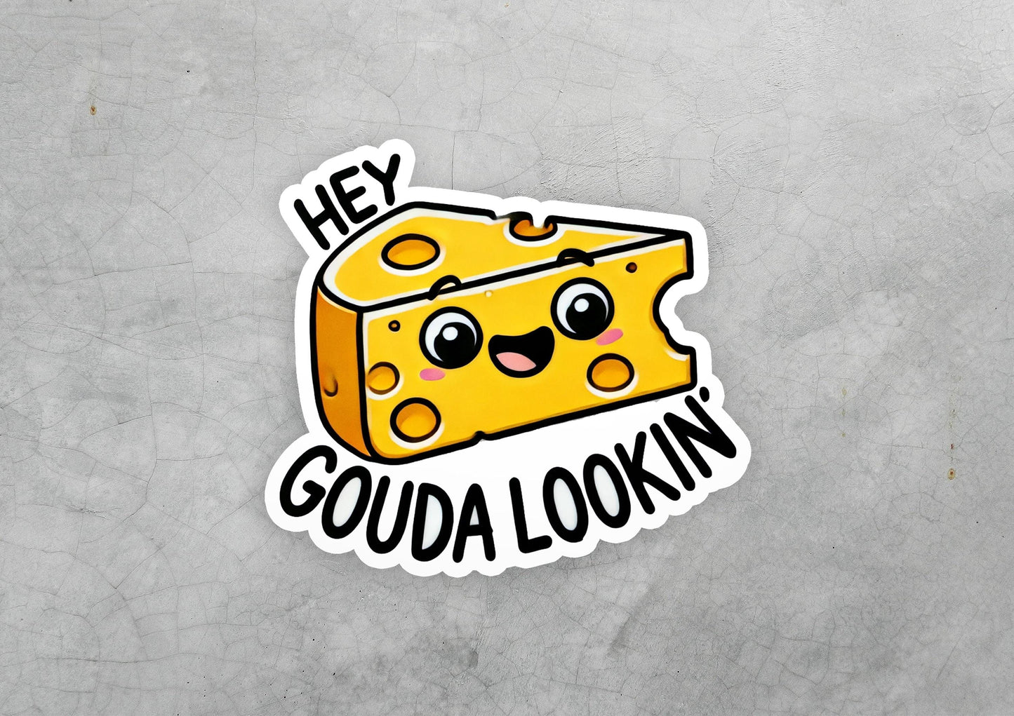 a sticker of a piece of cheese with the words hey, goudaa