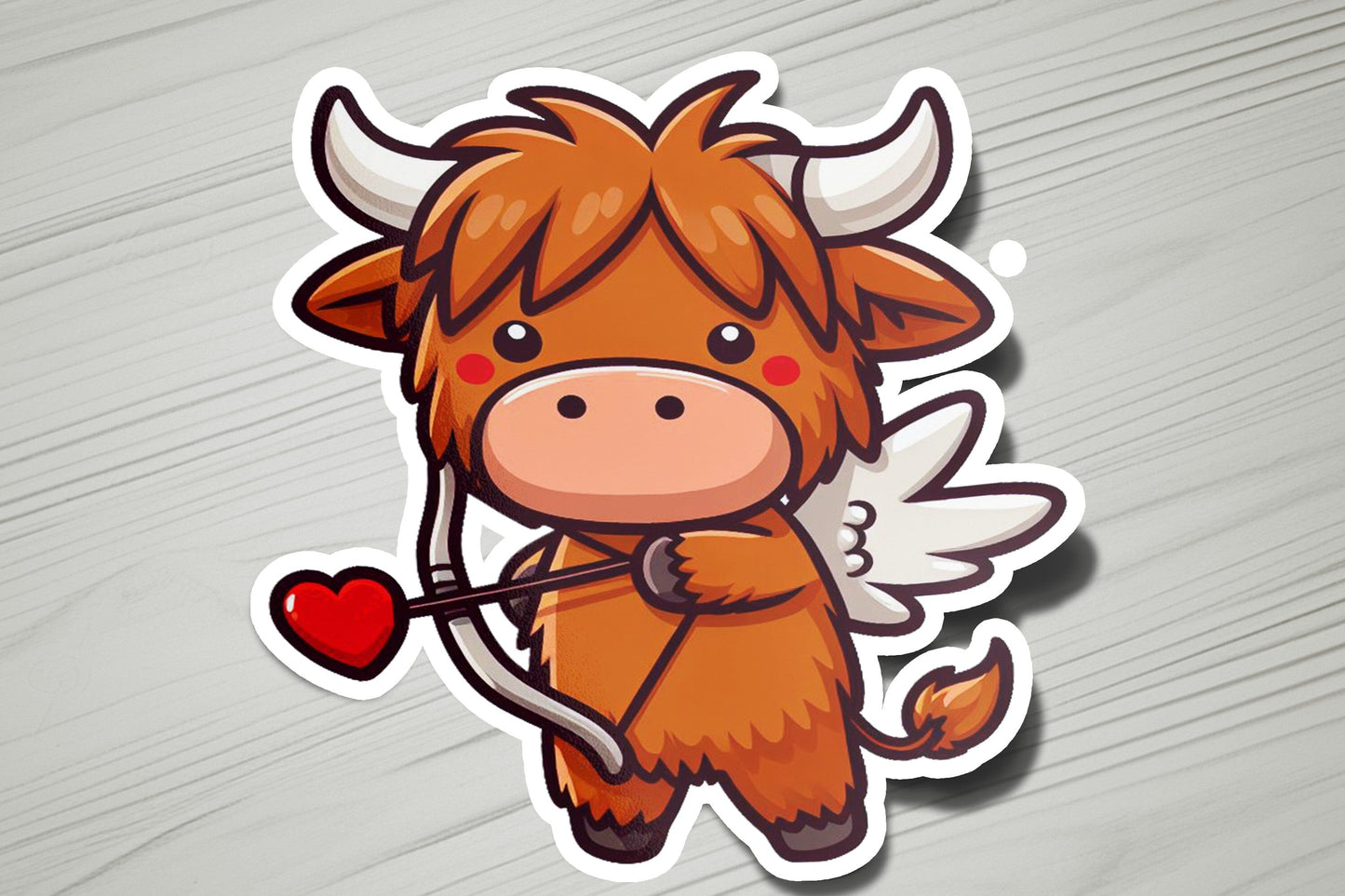 a sticker of a bull with wings and a heart