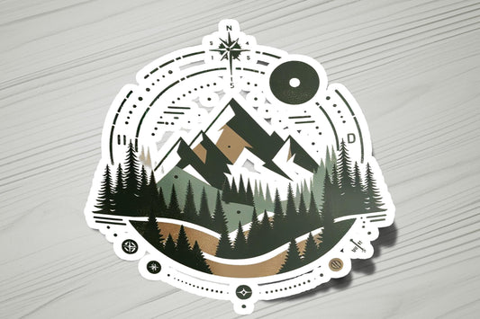 a sticker with a mountain scene in the middle of it