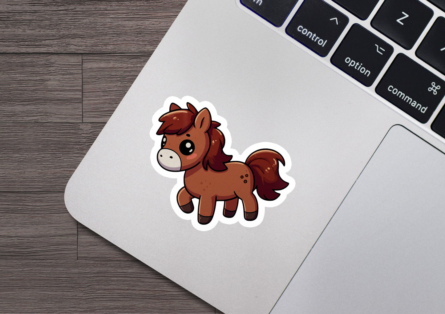 a sticker of a horse on a laptop