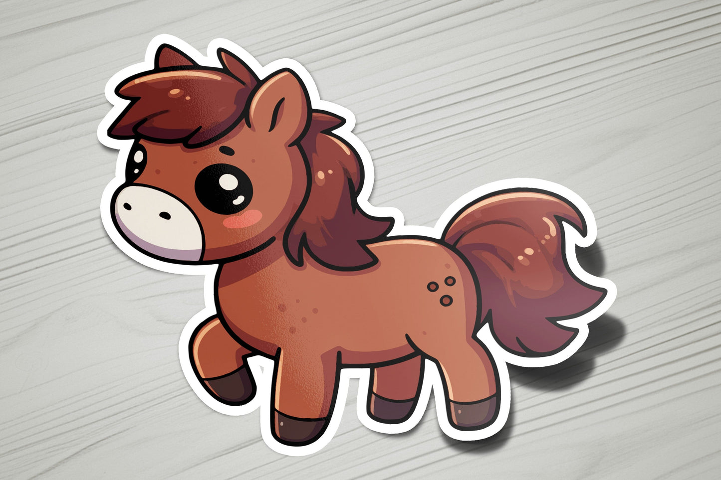 a sticker of a brown horse on a wooden surface