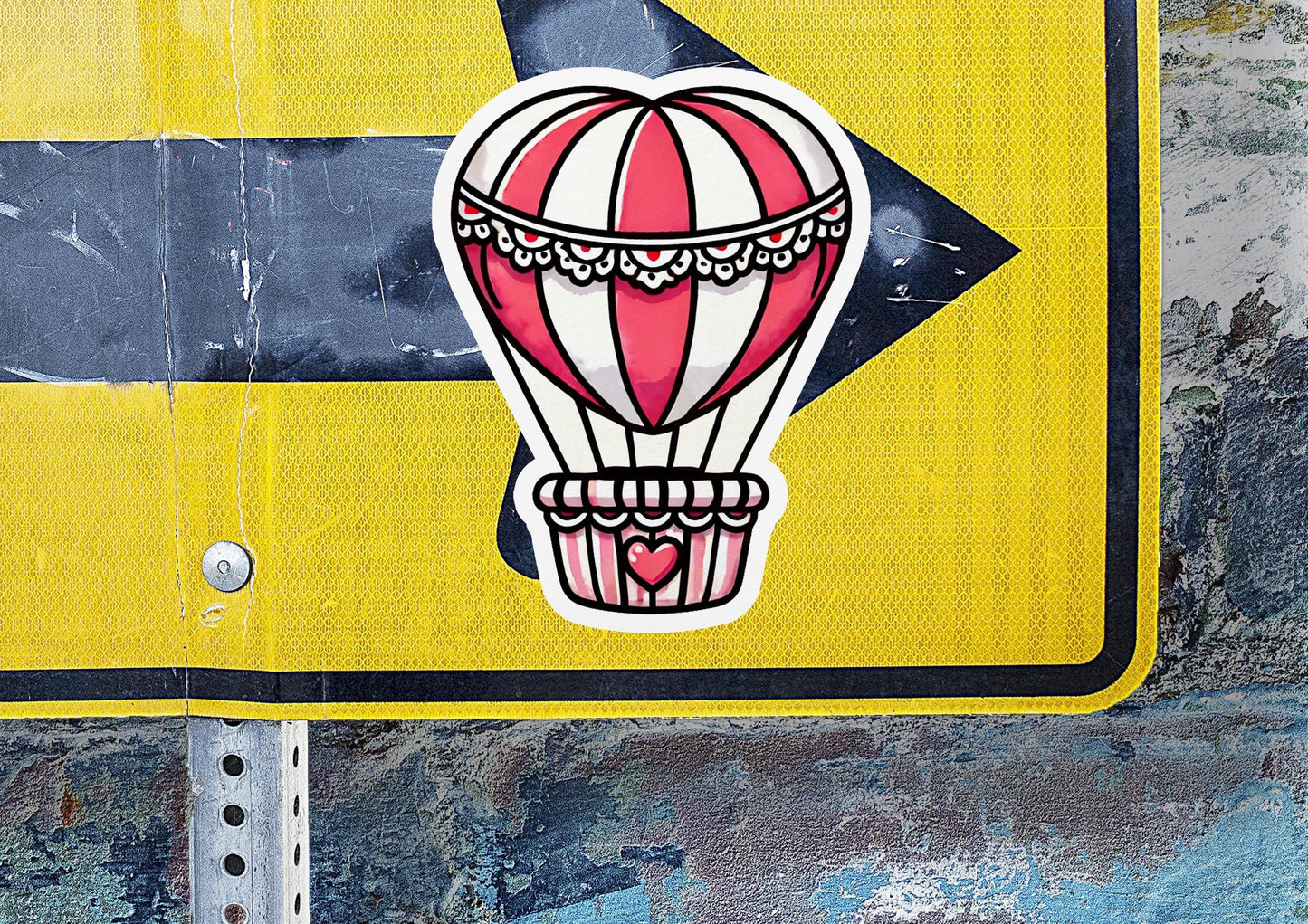 a street sign with a hot air balloon on it