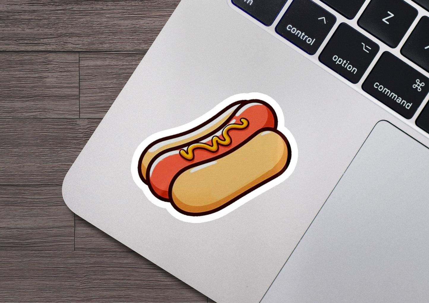 a sticker of a hot dog on a laptop