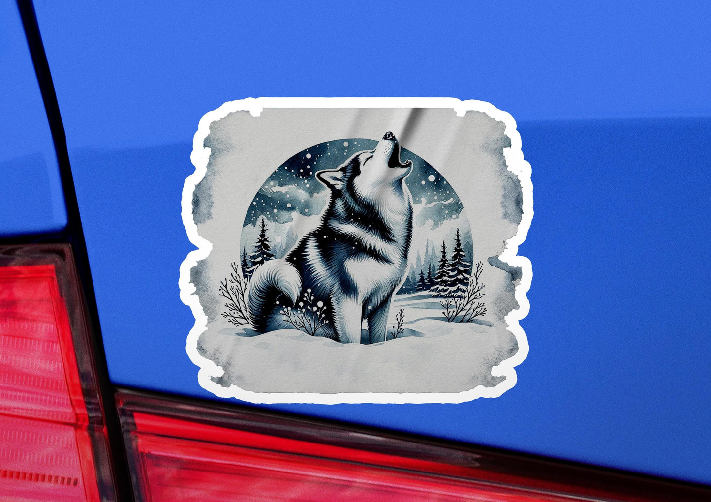 a sticker of a wolf on the back of a car