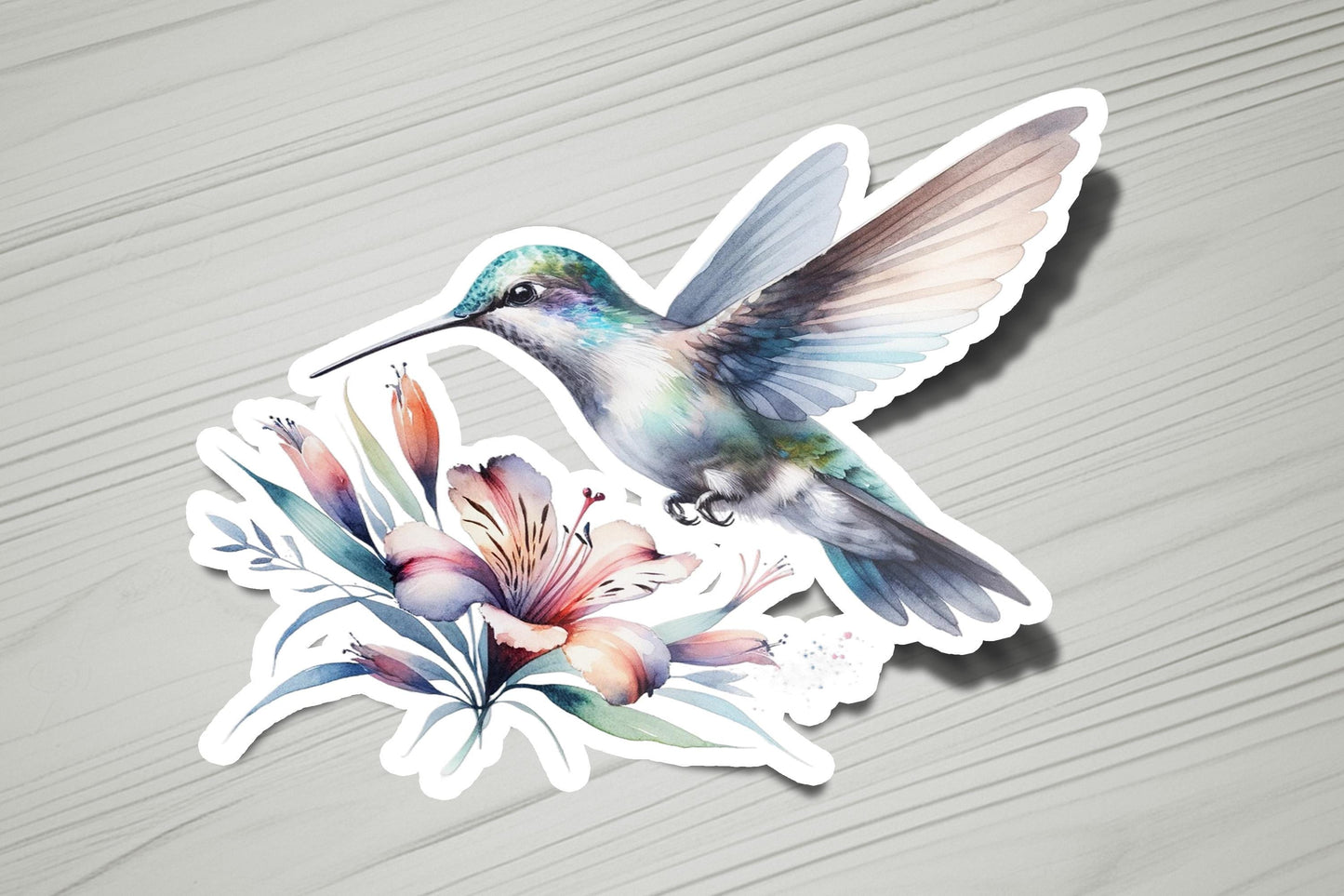 a sticker of a hummingbird with flowers on it