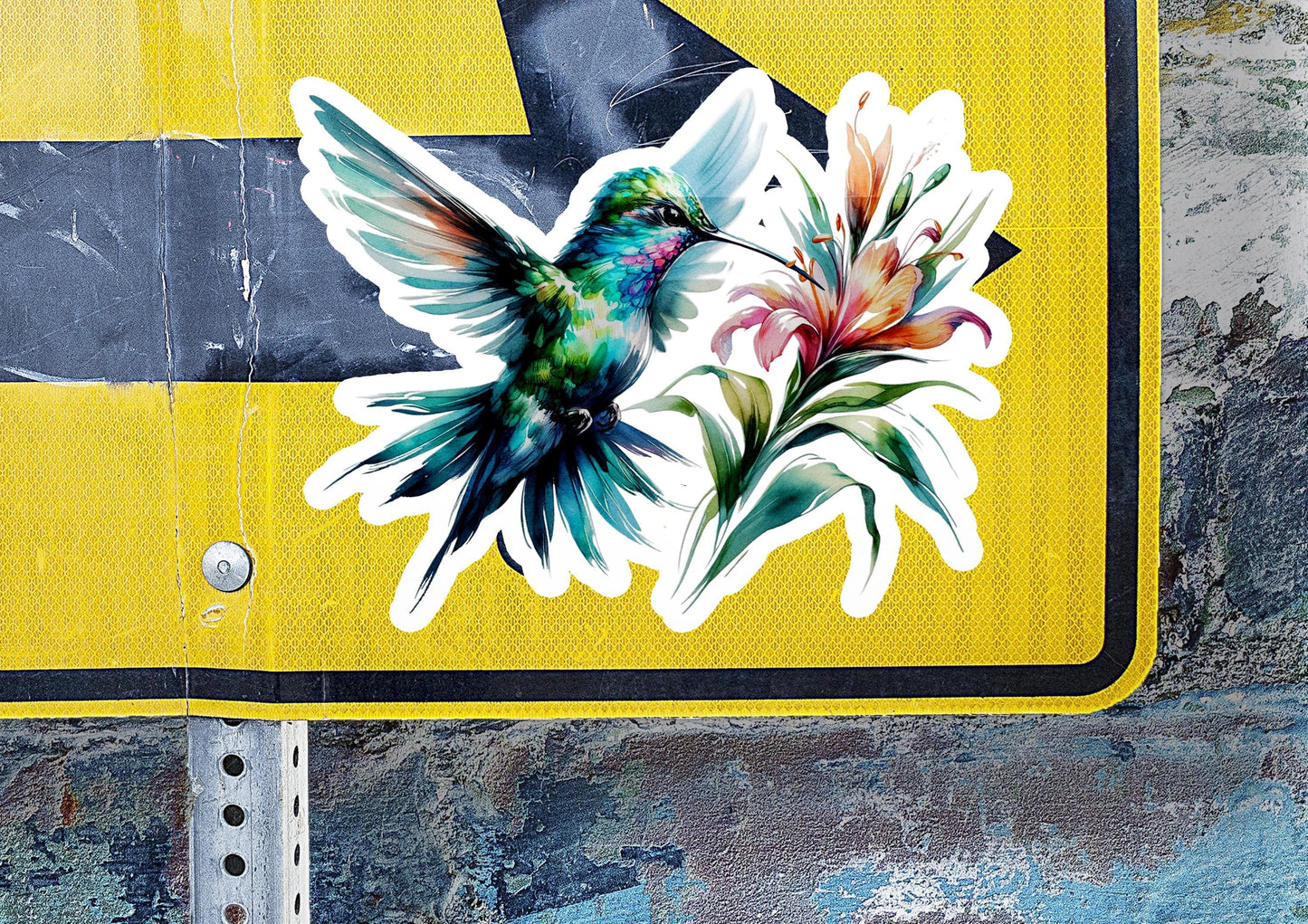 a sticker of a hummingbird on a street sign