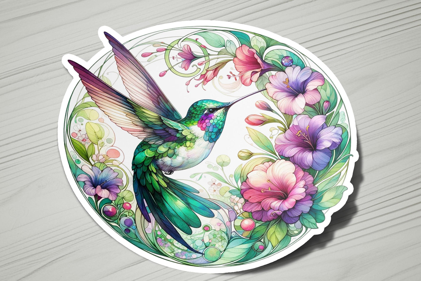 a sticker with a hummingbird and flowers on it