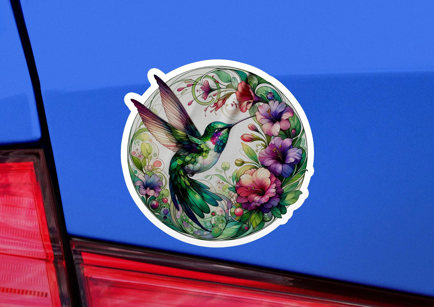 a sticker of a hummingbird with flowers on it