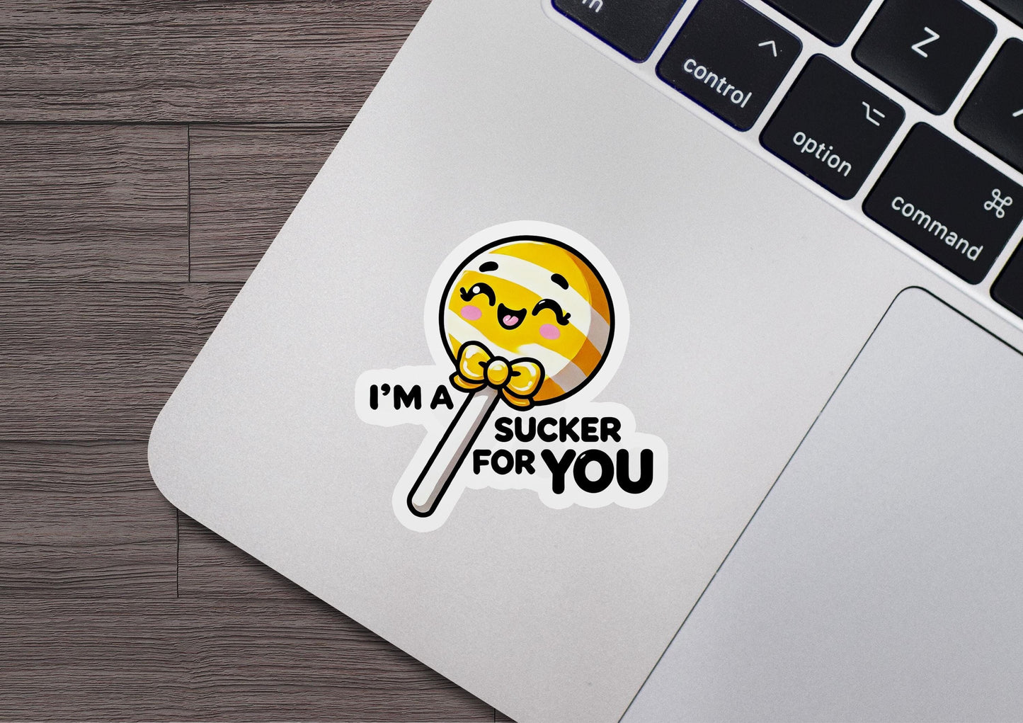 i'm a sucker for you sticker on a laptop