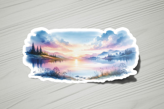 a sticker with a painting of a lake at sunset