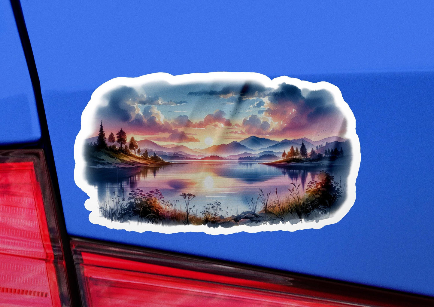 a sticker of a sunset over a lake