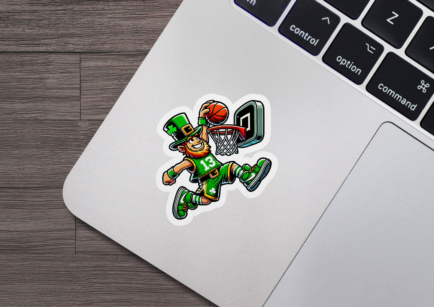 a laptop with a sticker of a basketball player