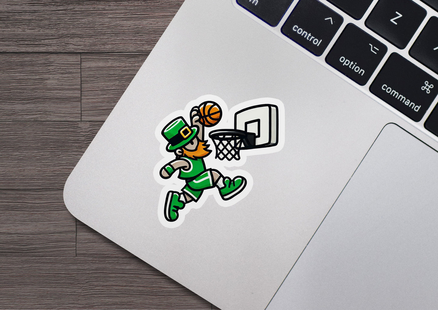 a laptop with a sticker of a basketball player