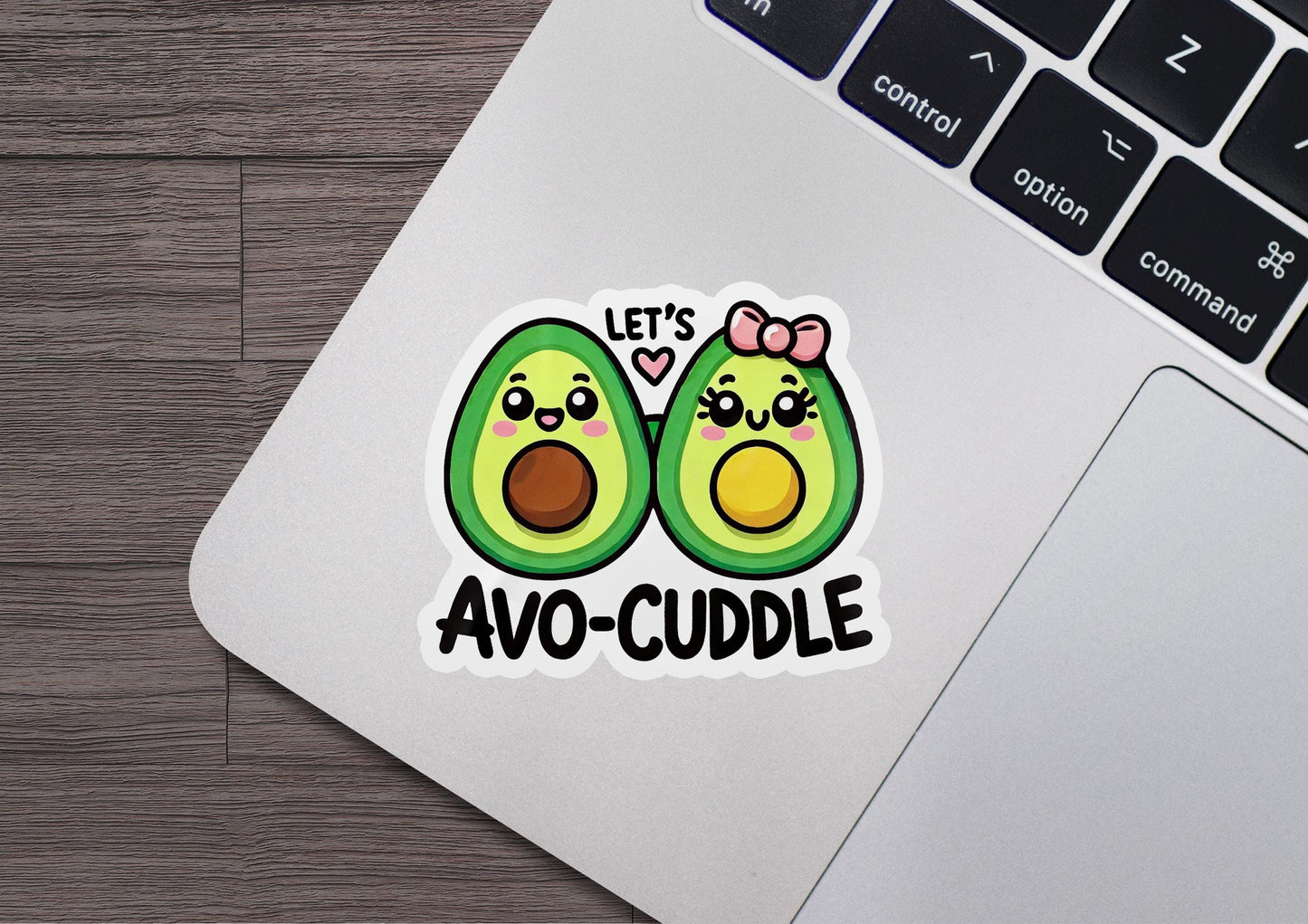 an avocado sticker on a laptop computer