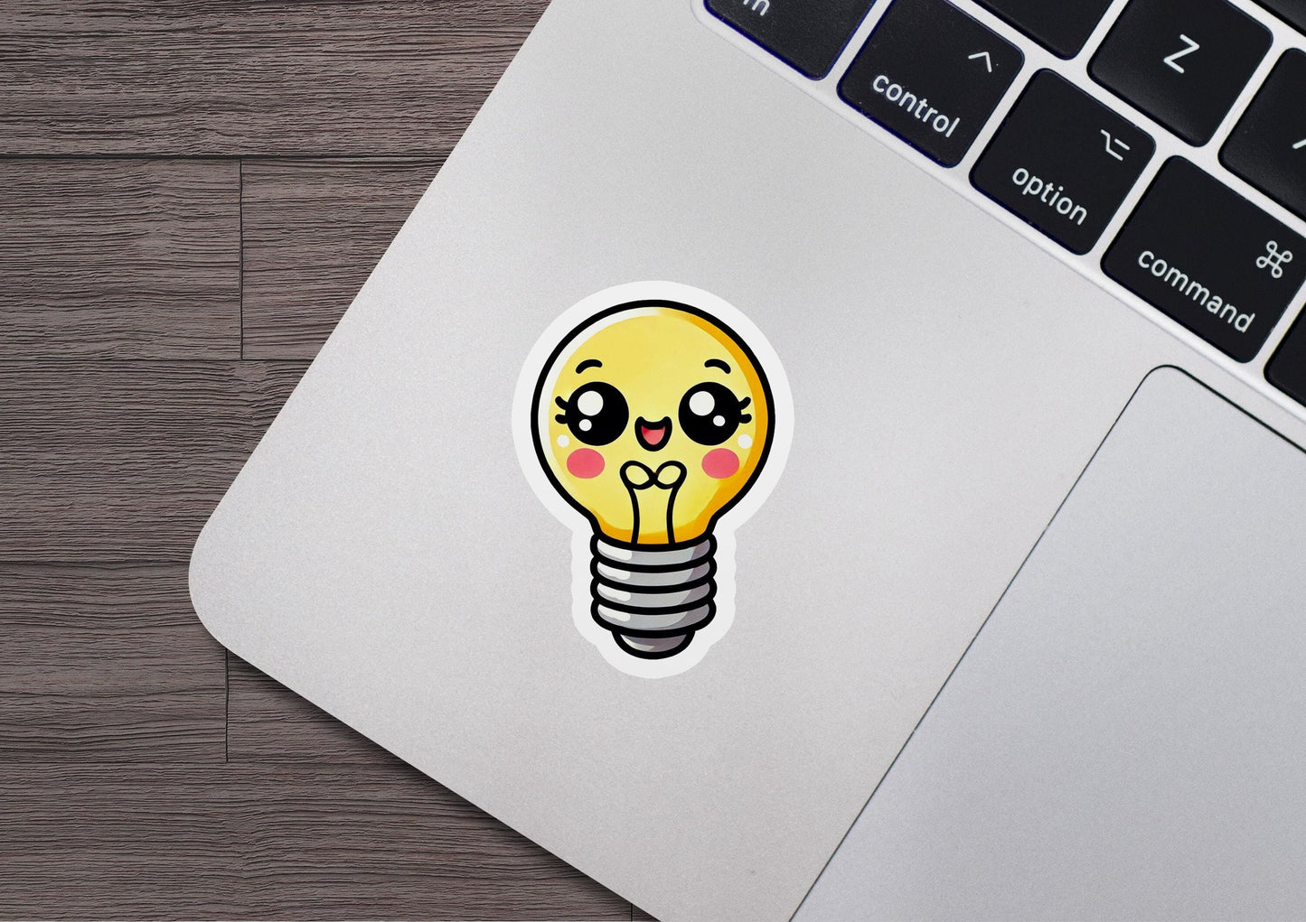 a laptop with a sticker of a light bulb