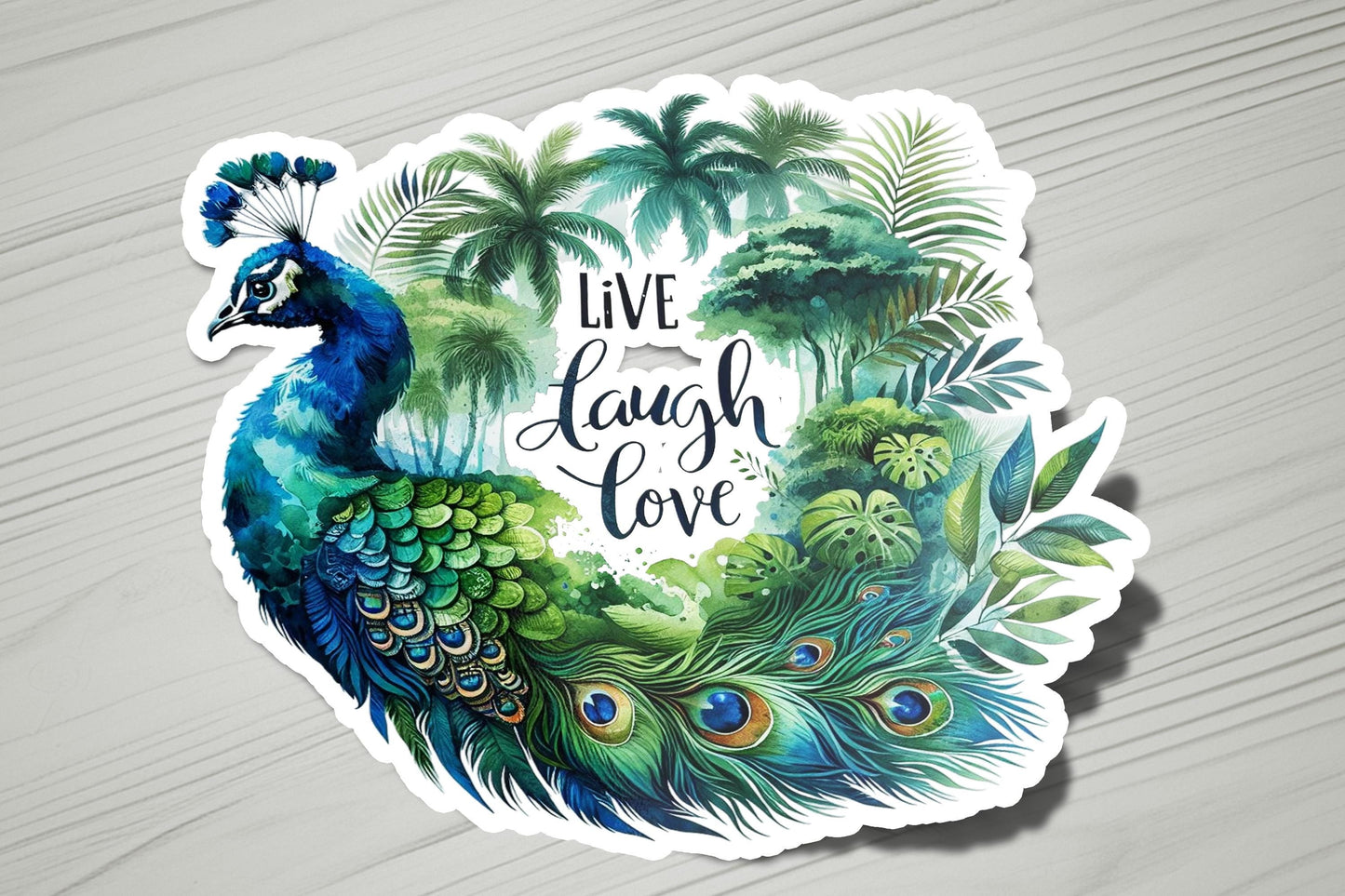 a sticker of a peacock with the words live laugh love