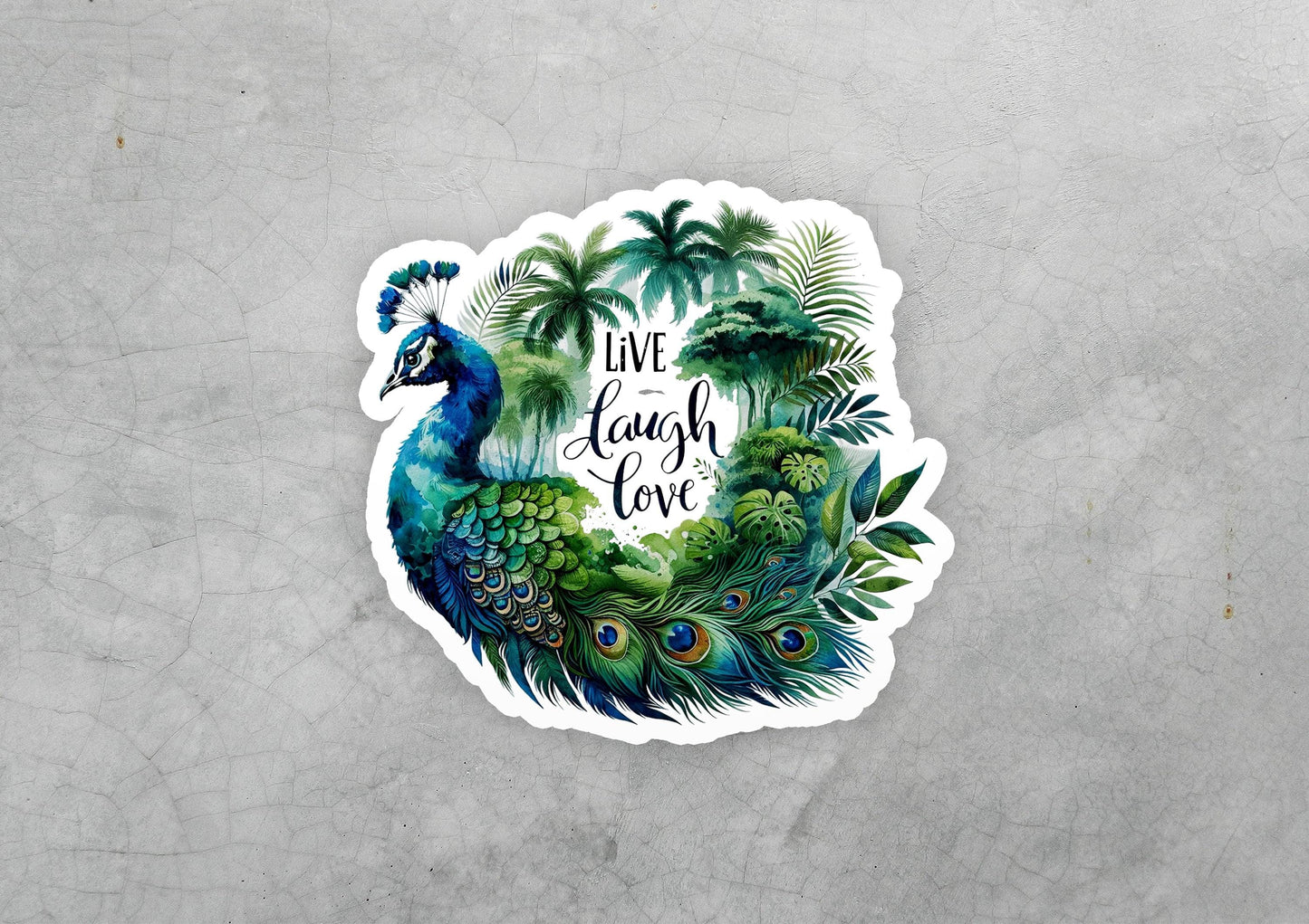 a sticker of a peacock with the words live laugh love