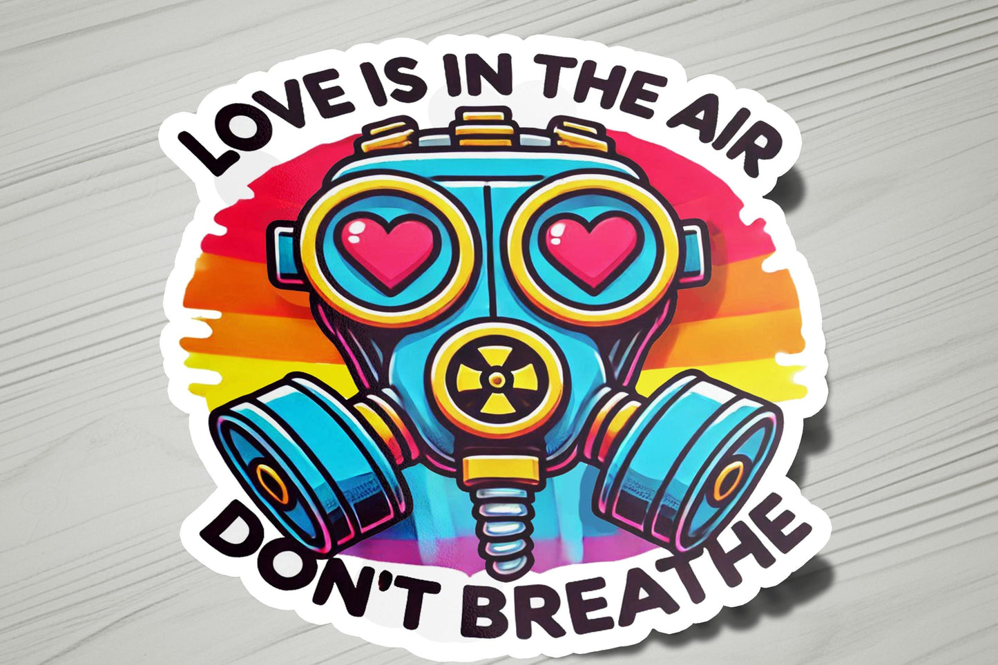 a sticker that says love is in the air don't breathe