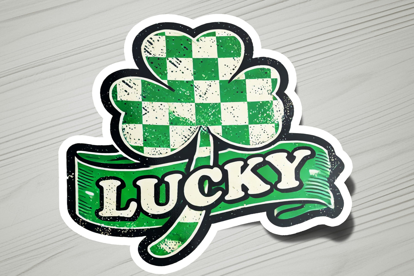 a sticker that says lucky with a clover