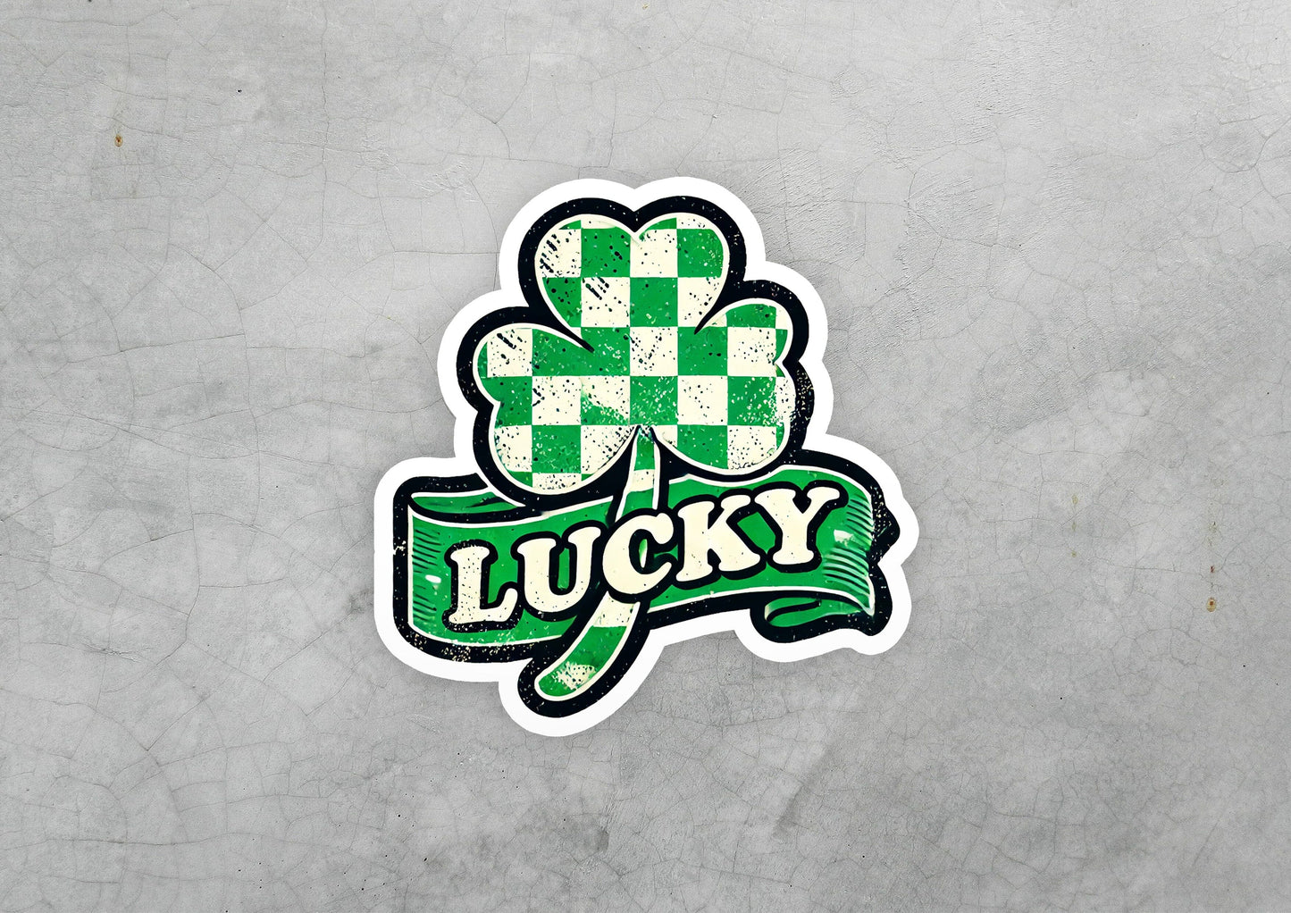 a sticker of a clover with the word lucky on it
