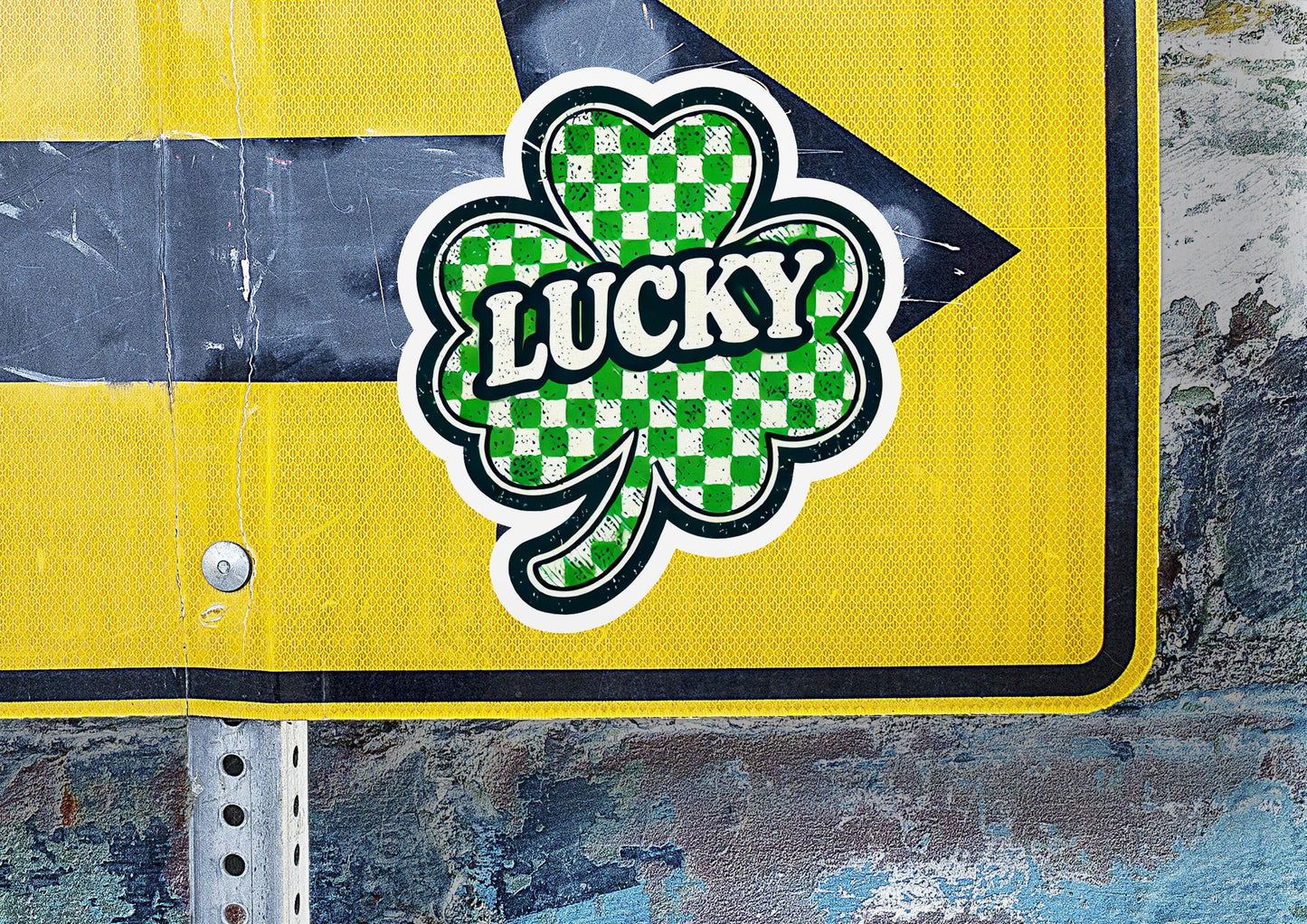 a street sign with a four leaf clover on it