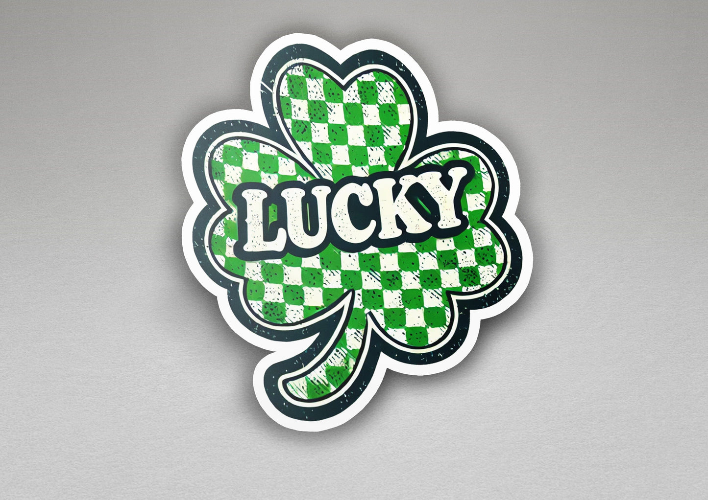 a sticker of a clover with the word lucky on it