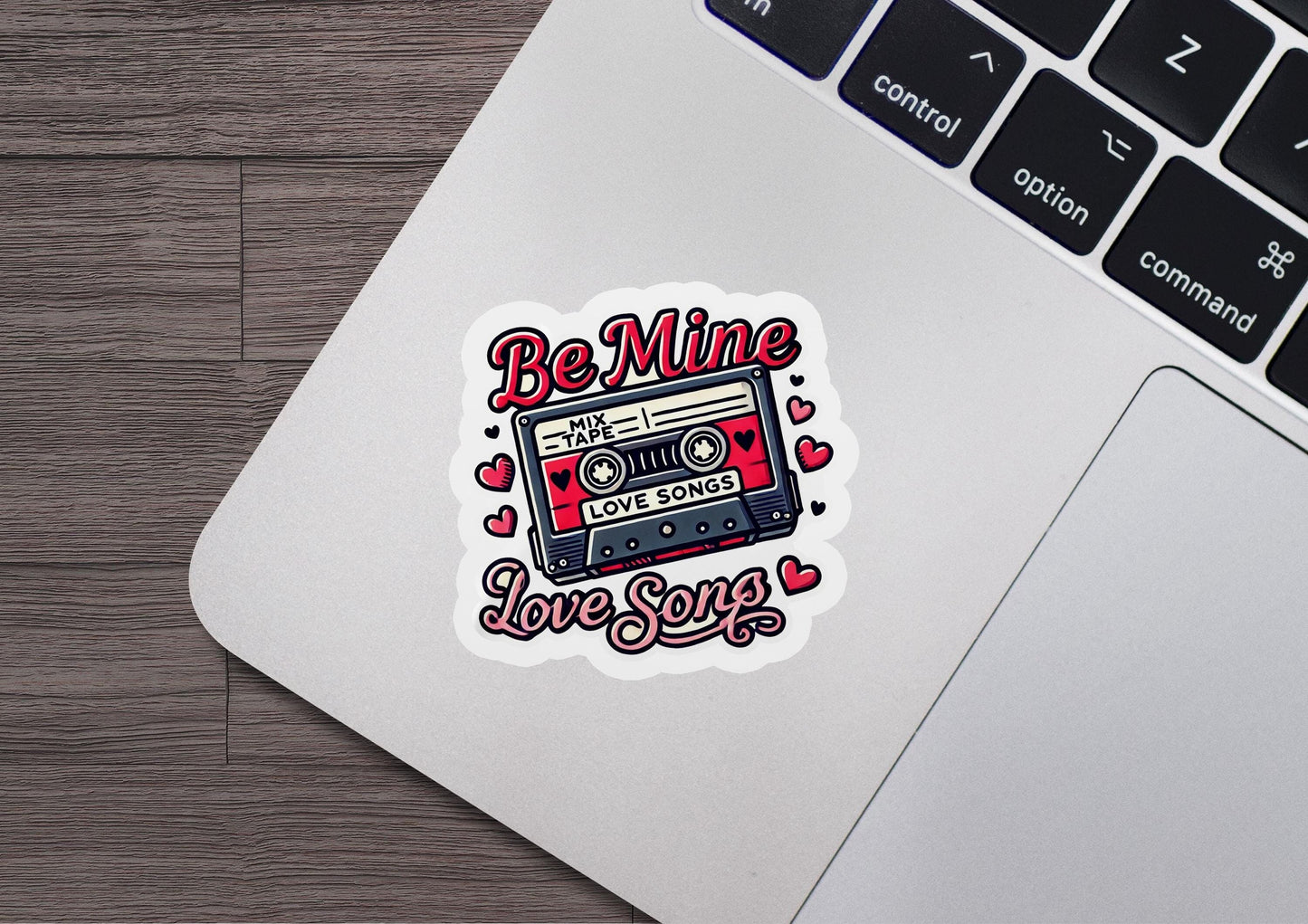 a laptop with a sticker of a tape recorder
