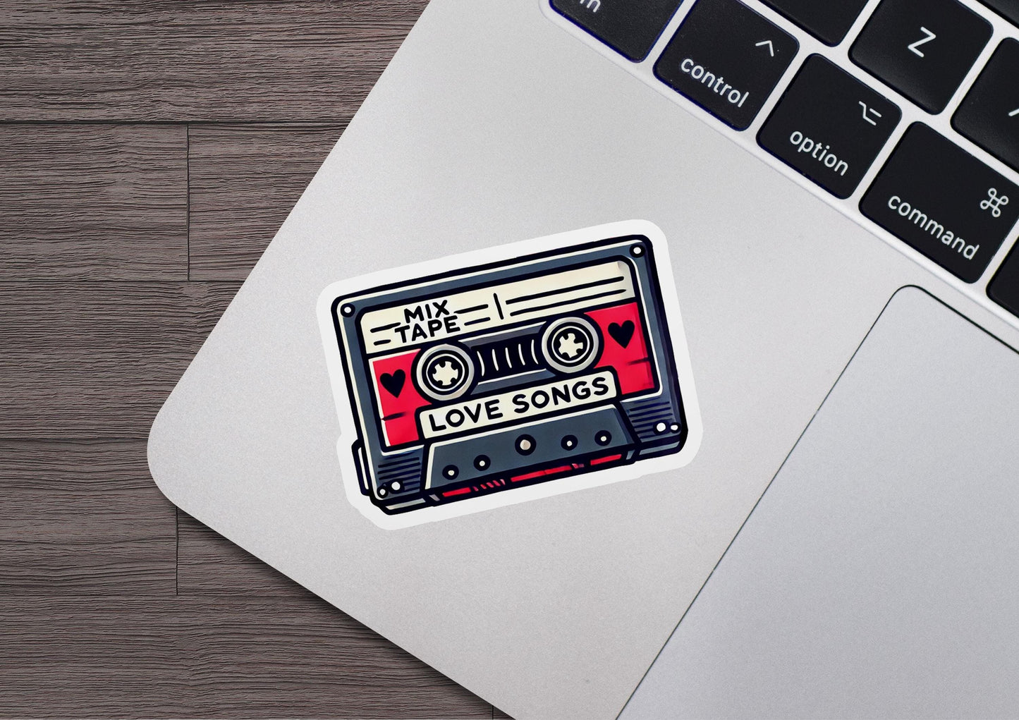 a sticker of a tape recorder on a laptop