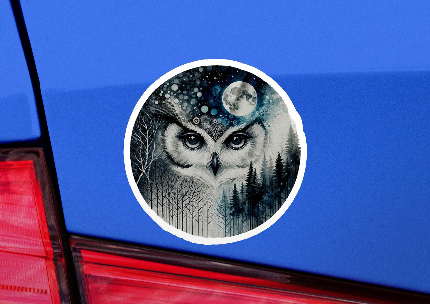 an owl sticker on the back of a car