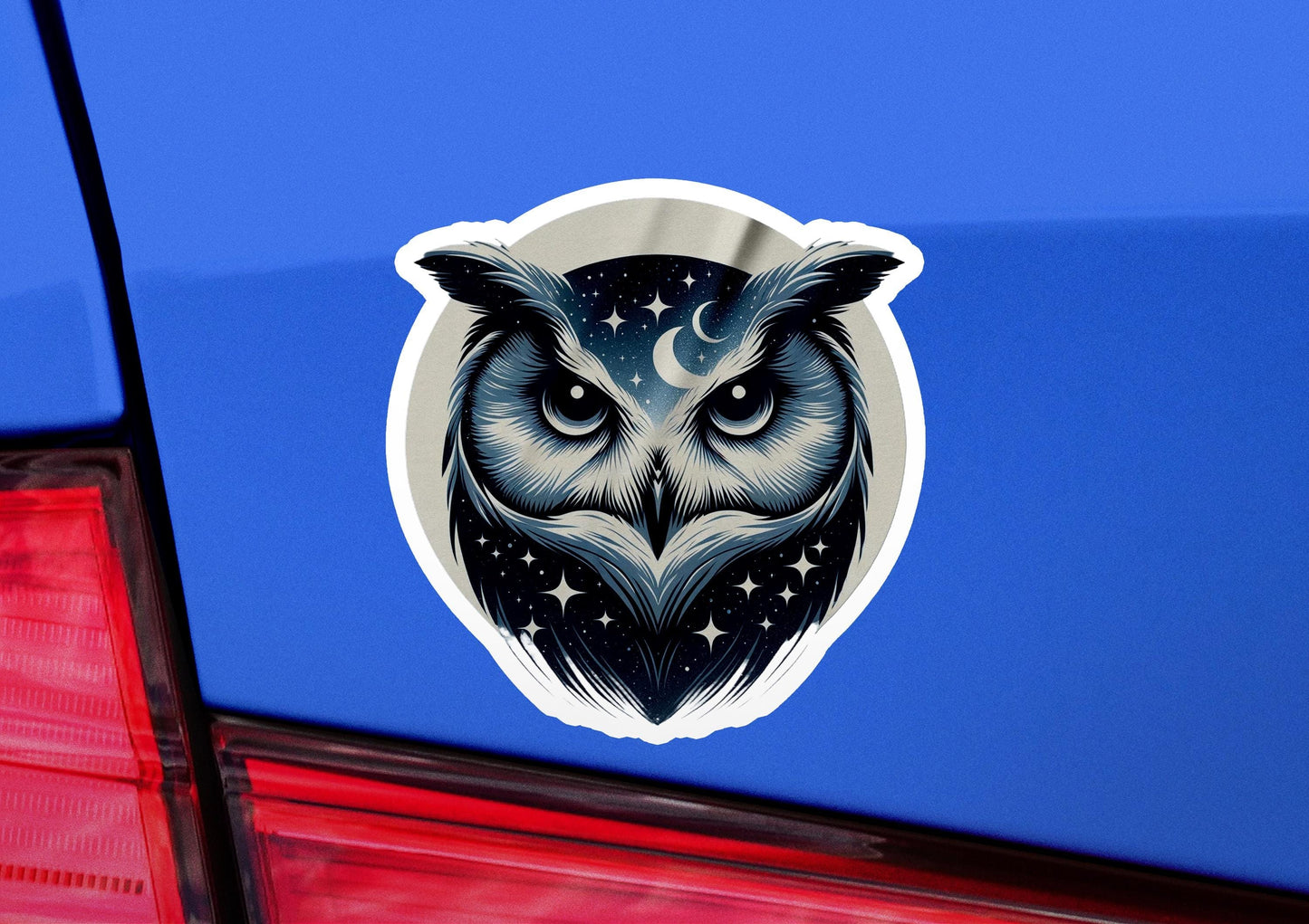 an owl sticker on the back of a car