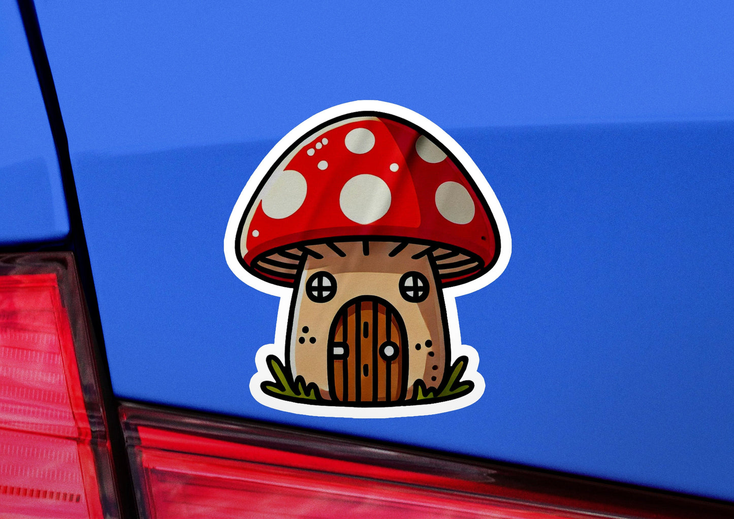 a sticker of a mushroom house on the back of a car