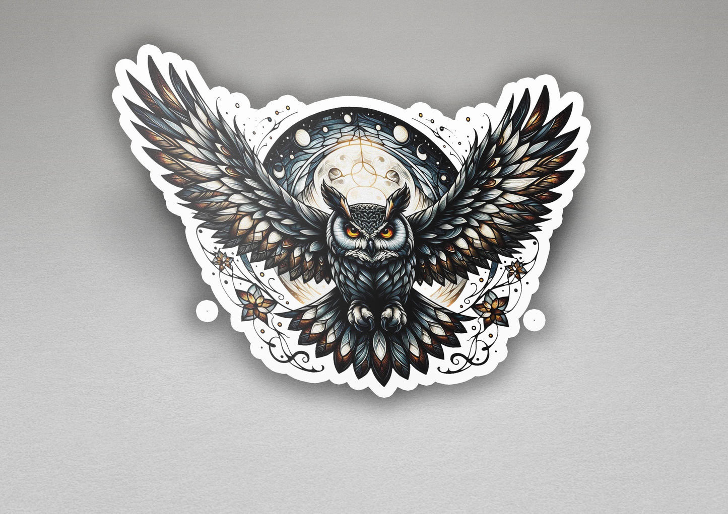 a sticker of an owl with wings on a gray background