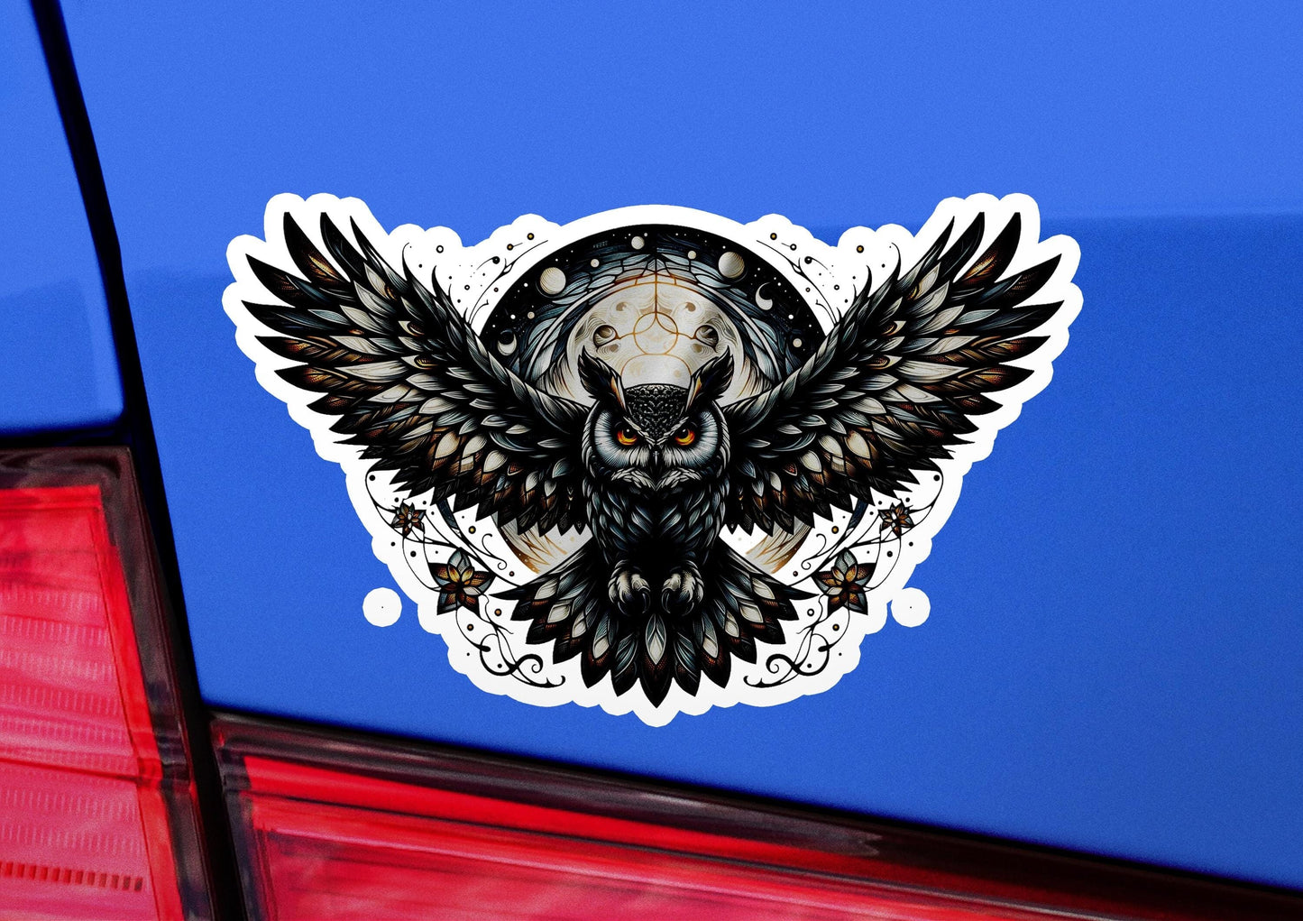a car with a sticker of an owl on it