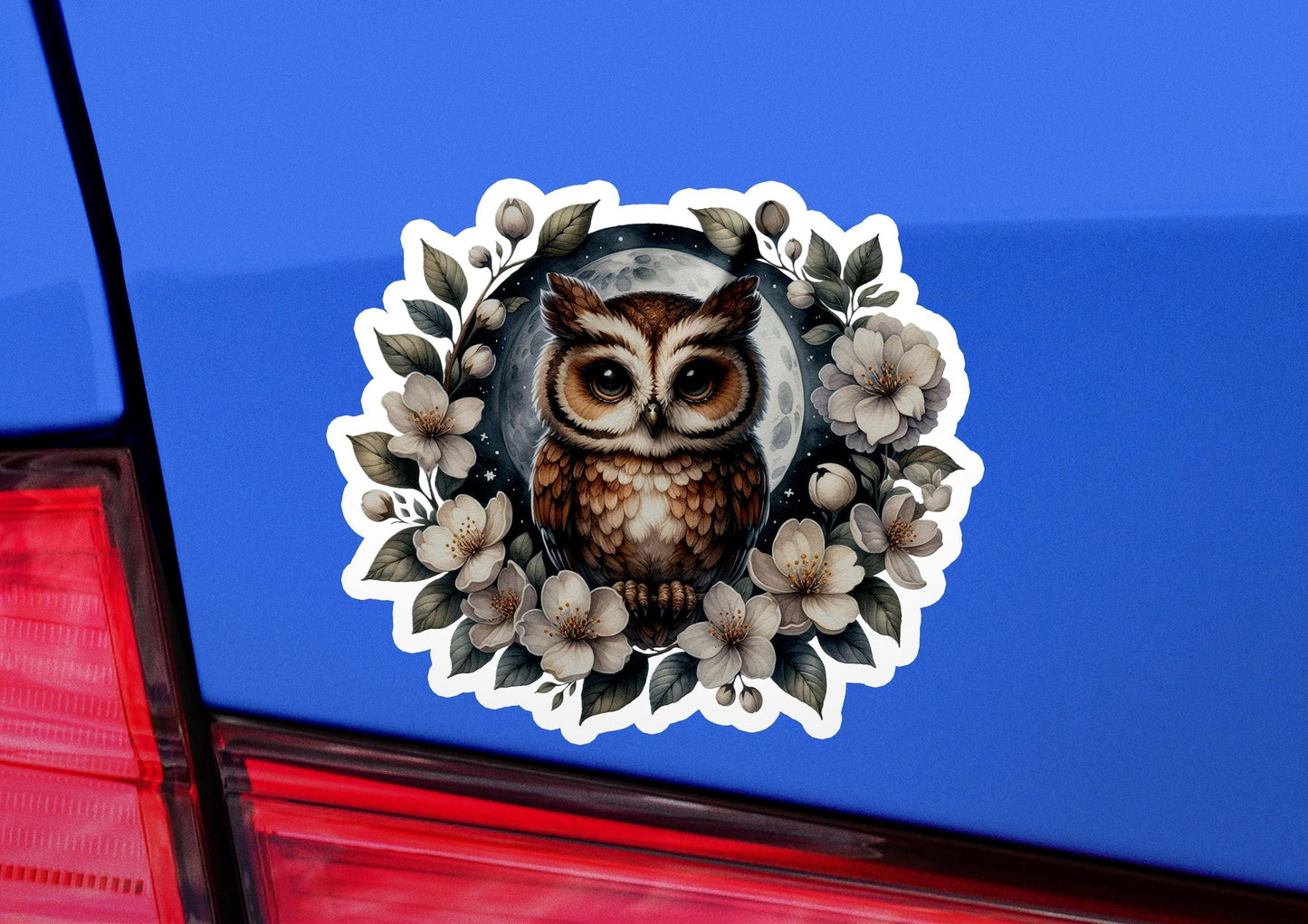 an owl sticker on the back of a car