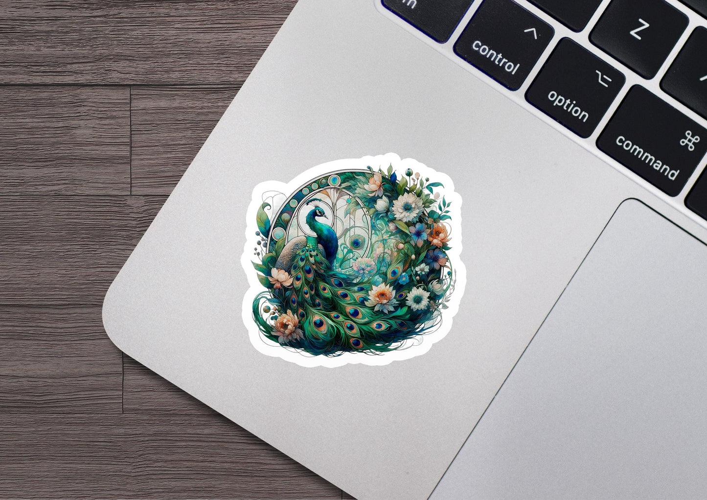 a laptop with a sticker of a peacock on it