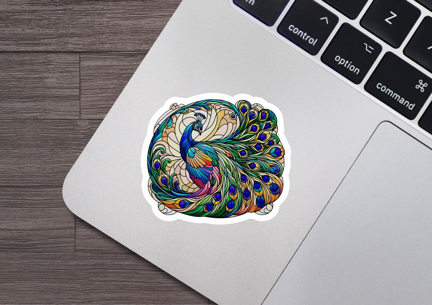 a laptop with a sticker of a peacock on it