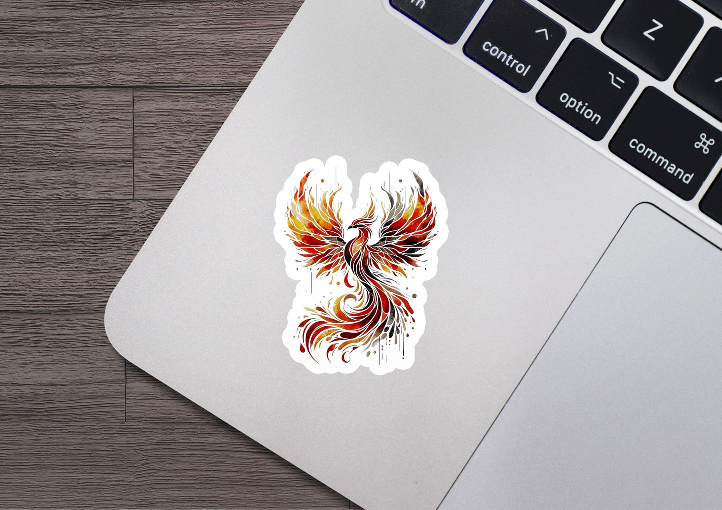 a laptop with a sticker of a bird on it