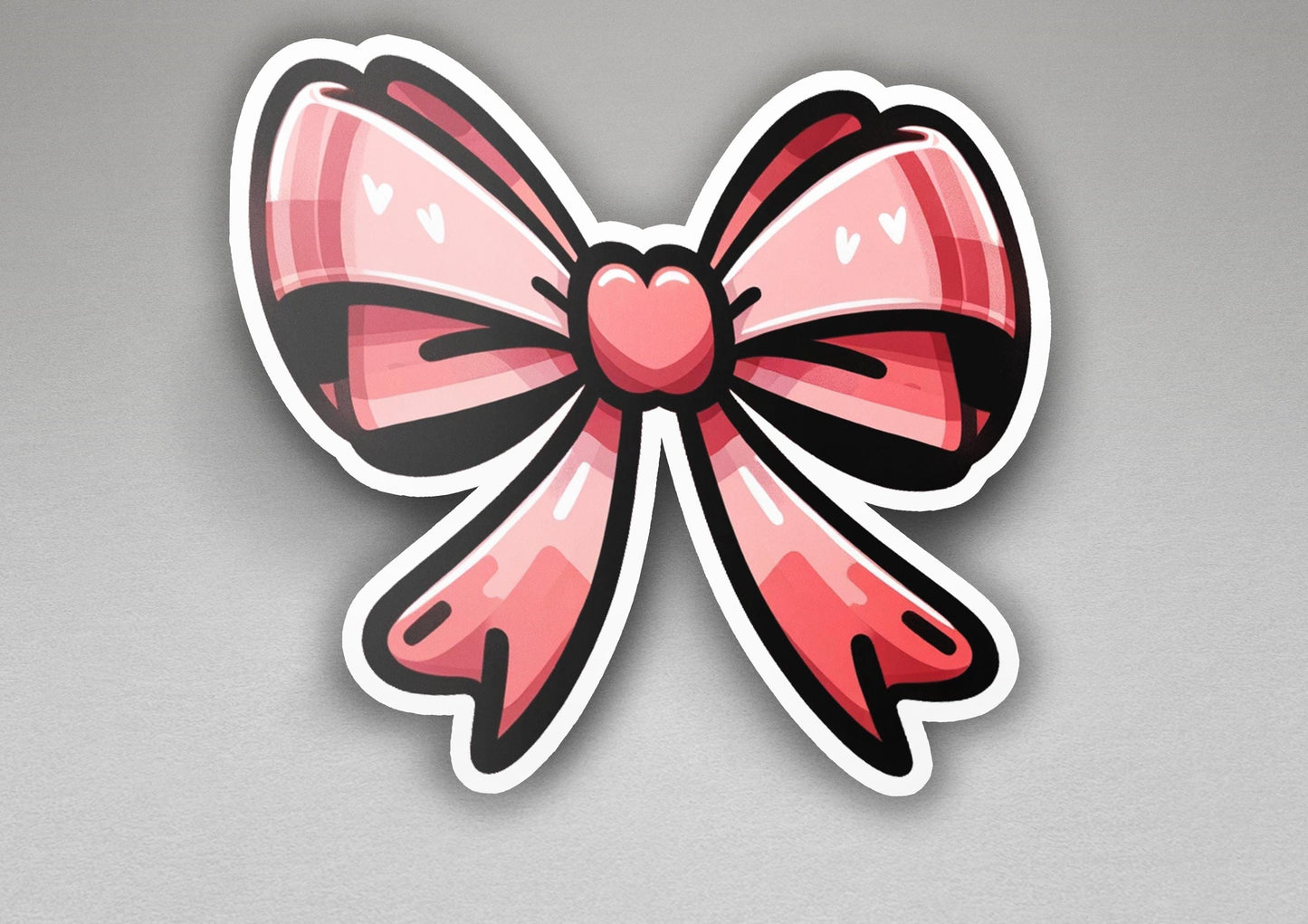 a sticker of a pink bow with a heart on it