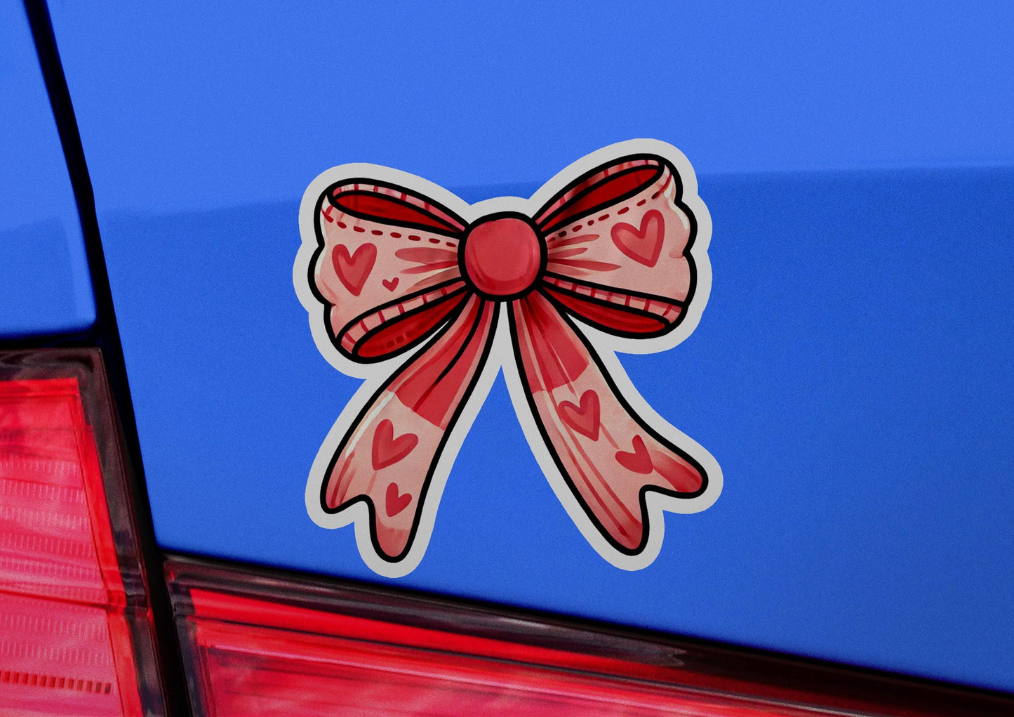 a car with a bow on the back of it
