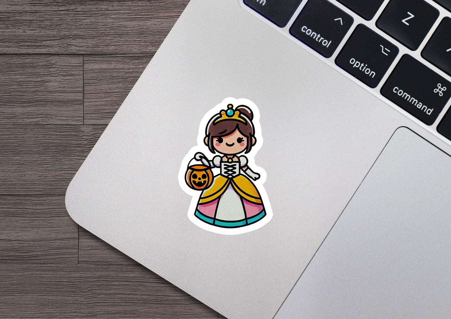 a laptop with a sticker of a princess holding a pumpkin