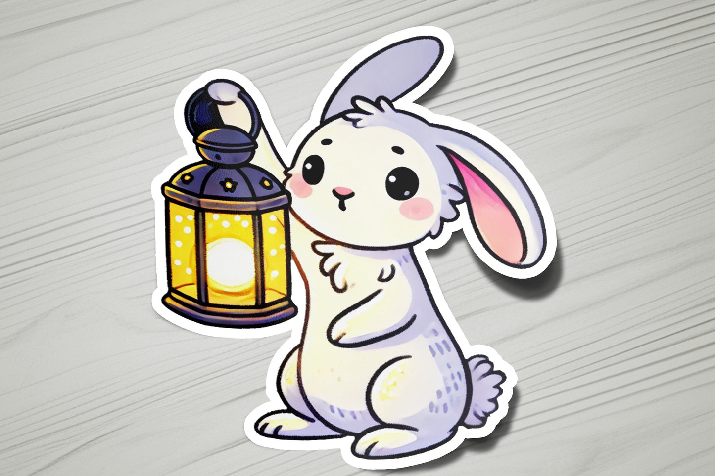 a sticker of a rabbit holding a lantern
