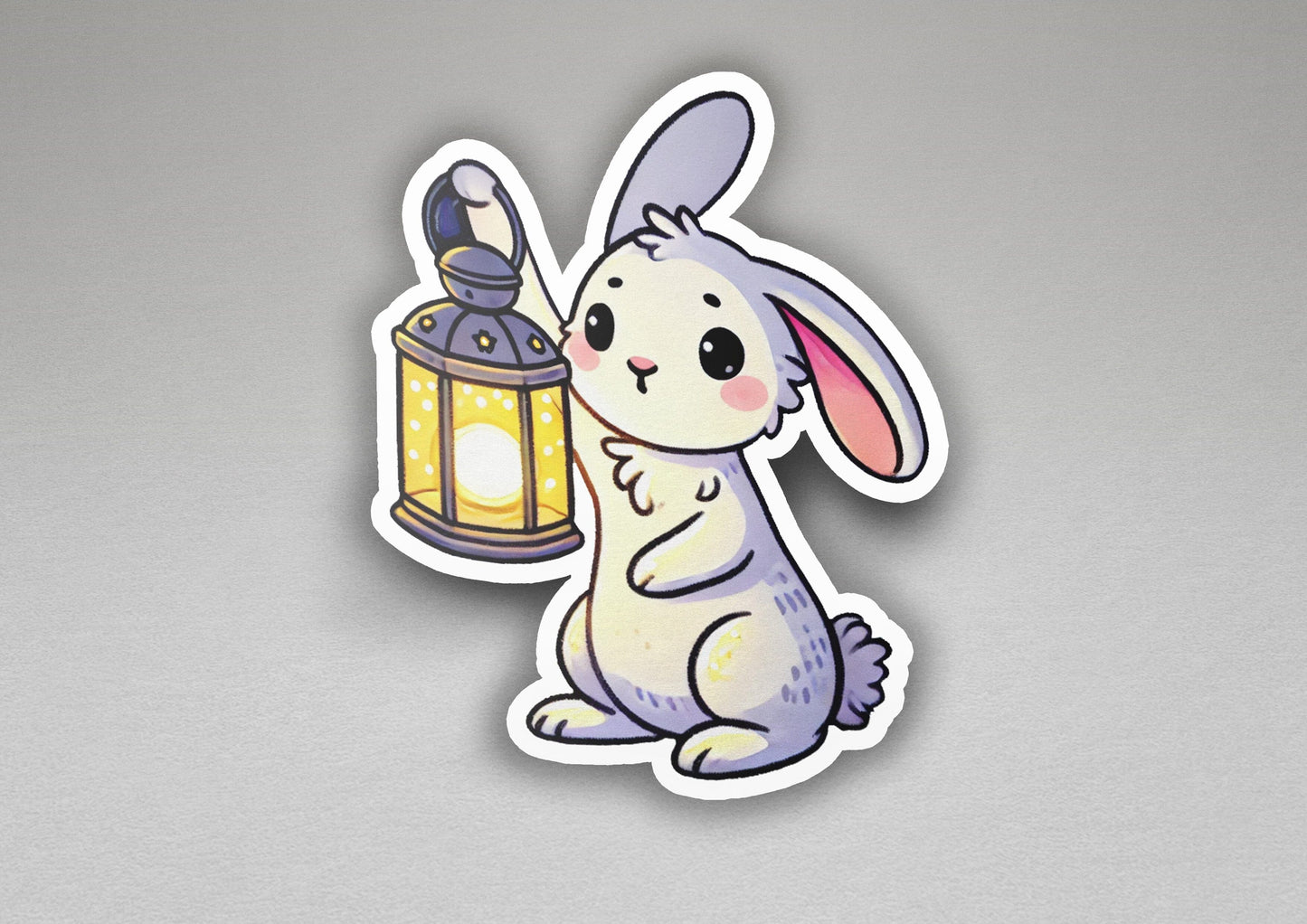 a sticker of a rabbit holding a lantern