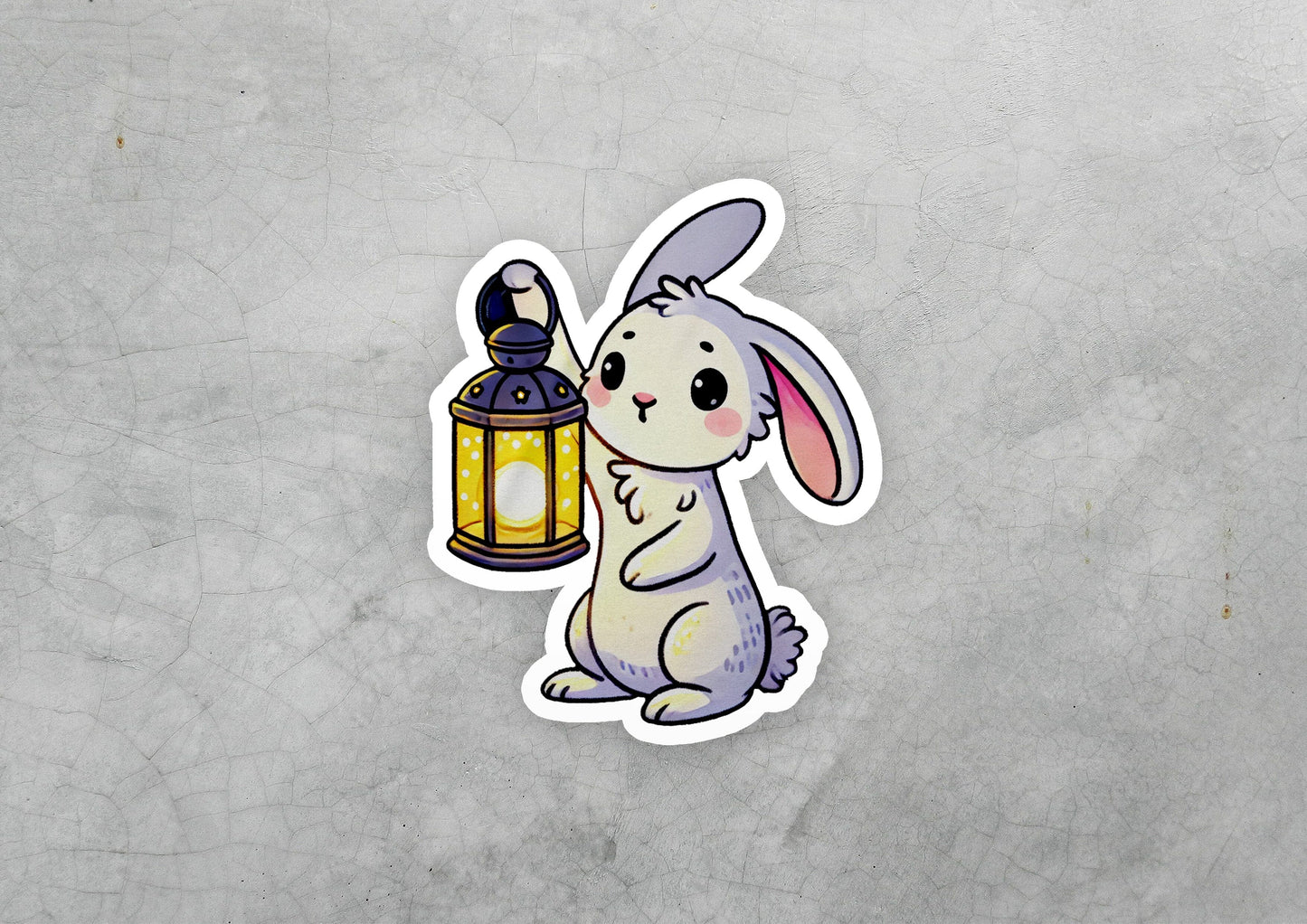 a sticker of a rabbit holding a lantern